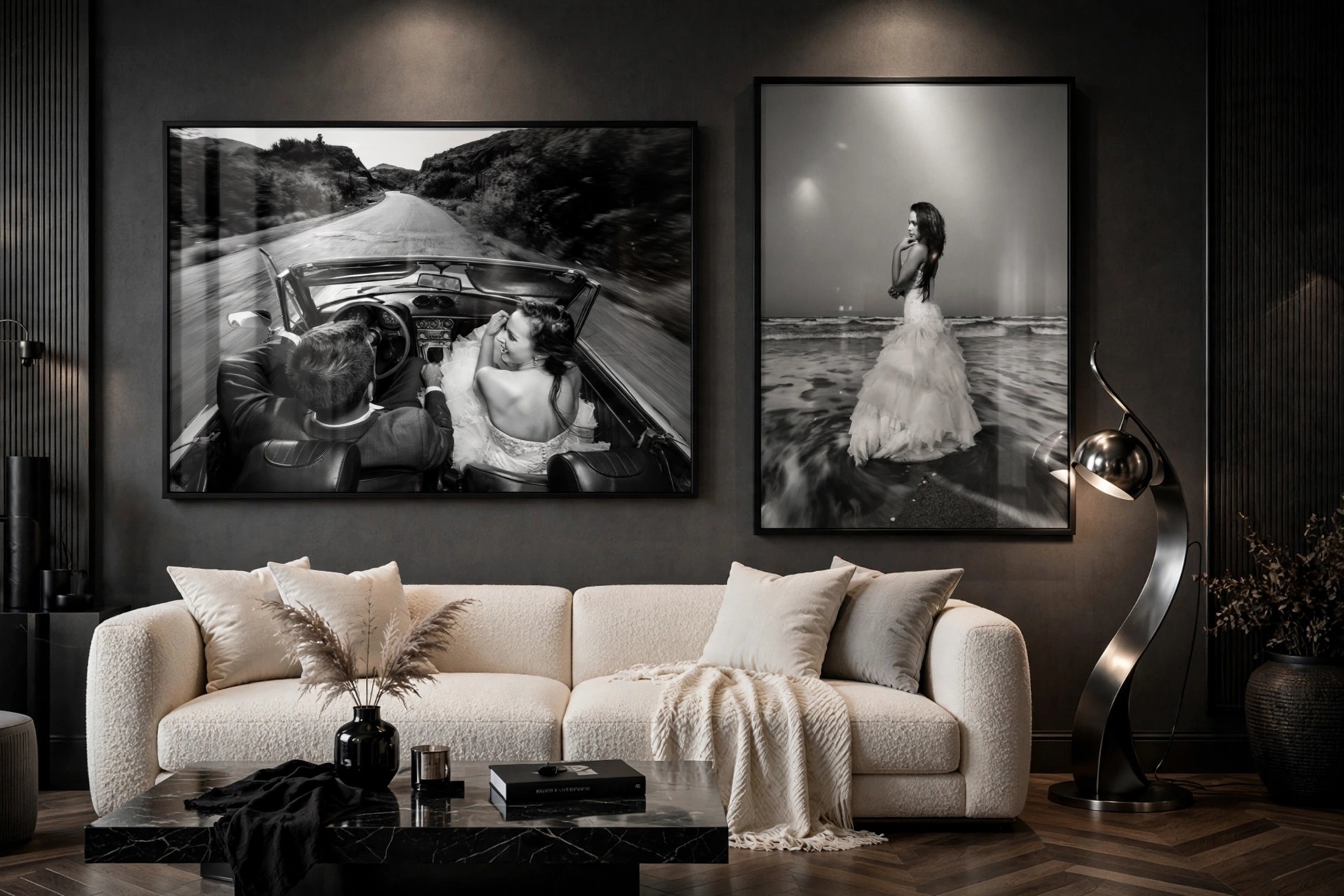 Two large black-and-white metallic wedding portraits with a glass finish displayed in a dramatic, elegant living room